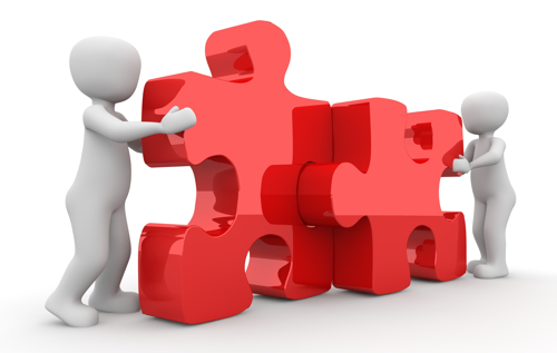 two people and puzzle pieces