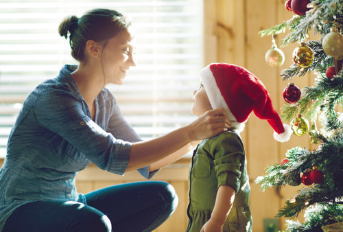 mom and child in santa hat