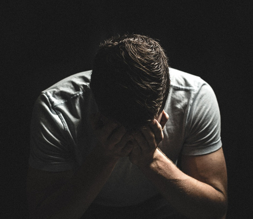 guy with head in hands
