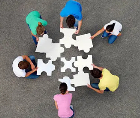 multiple people doing a puzzle
