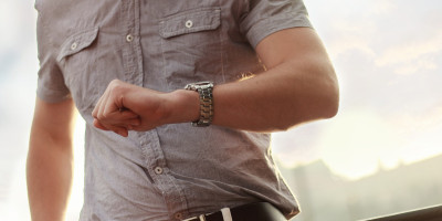 man looking at watch