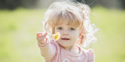 child with dandelion