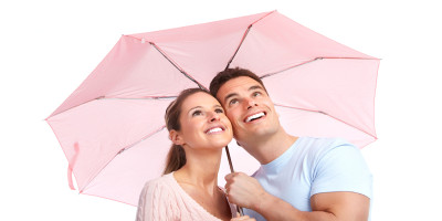couple under a pink umbrella