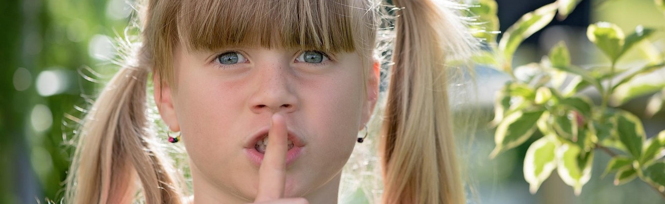 Girl showing Shhhh