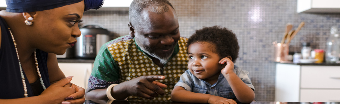 Grandparents talking with little boy