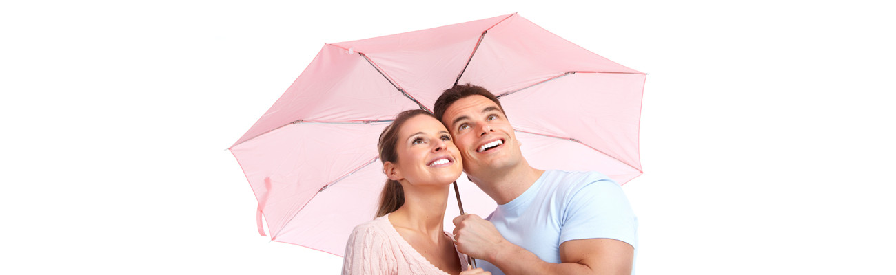 couple under a pink umbrella